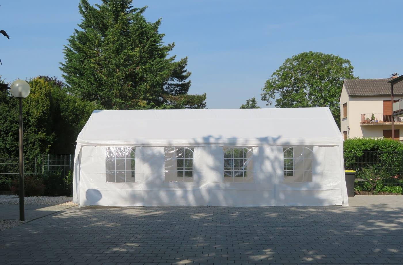 A pop-up canopy with a solid roof, set up outdoors.