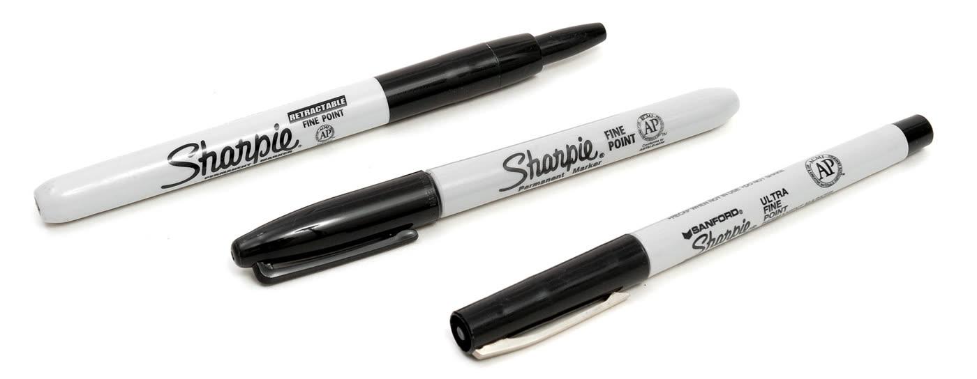 Sharpie permanent markers in a row, including a fine point.