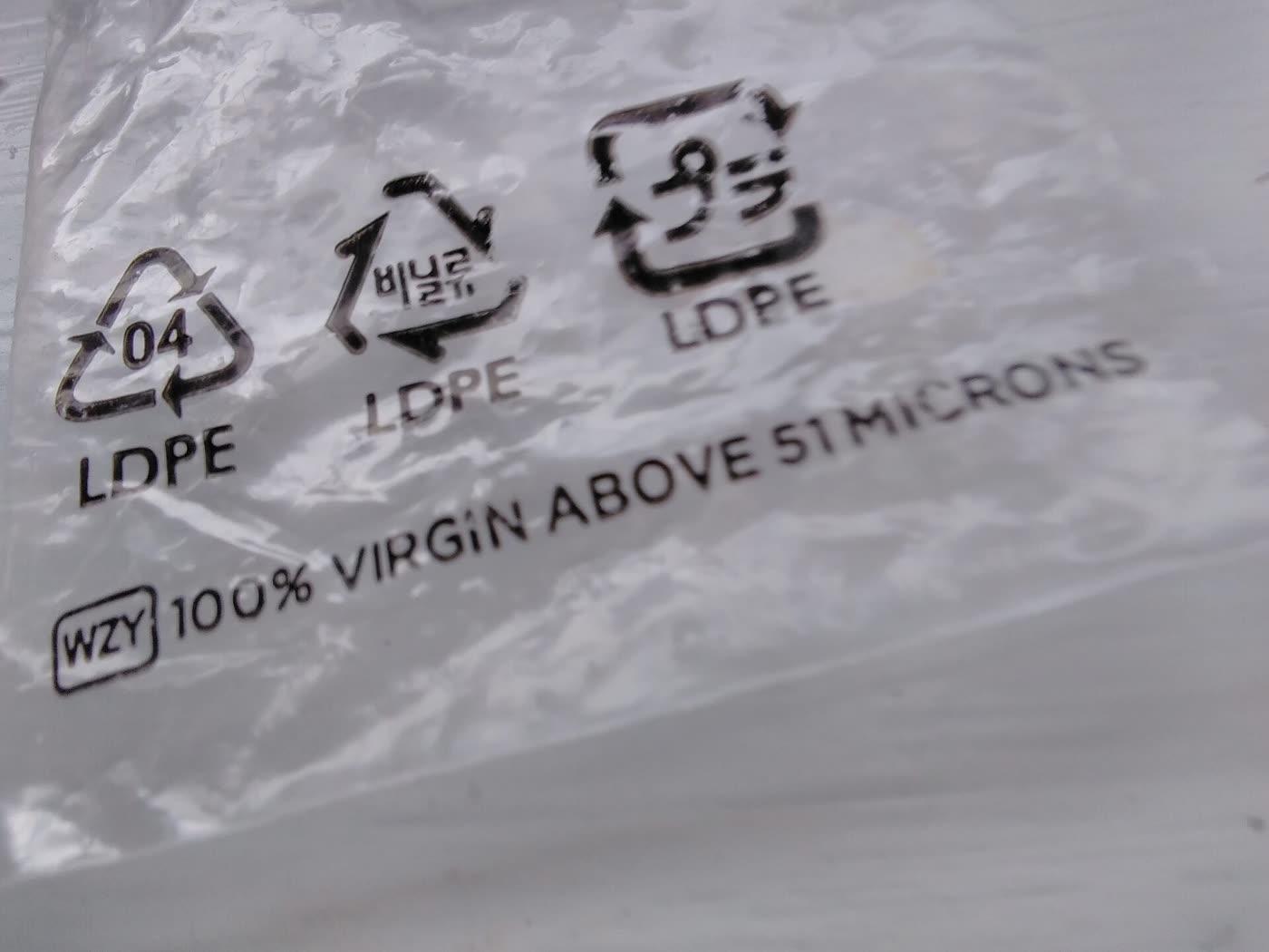 A clear resealable plastic bag with a green zipper.