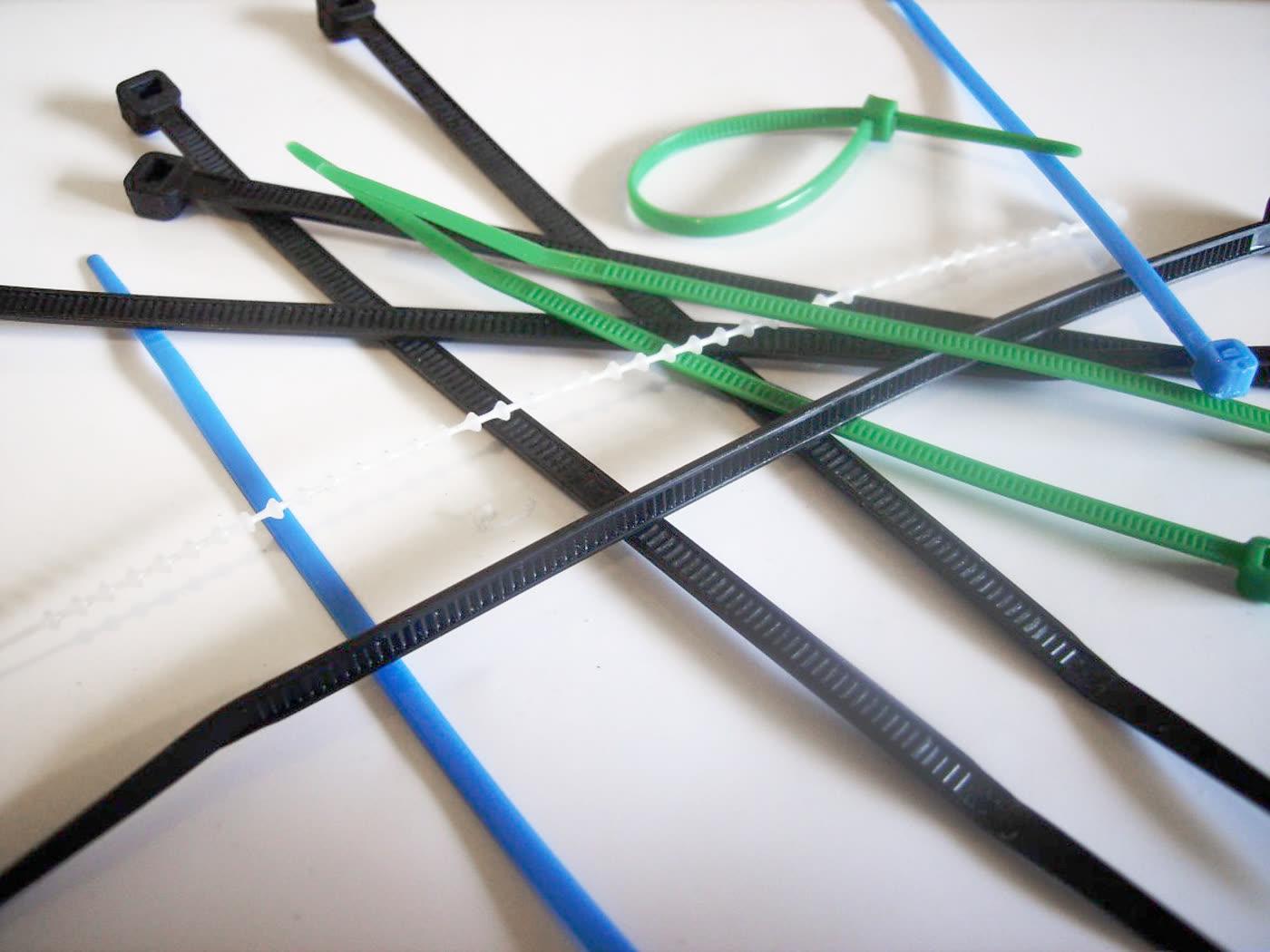 A pile of plastic cable ties in several colors.